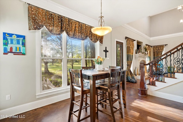 dining room with crown molding and dark hardwood / wood-style flooring