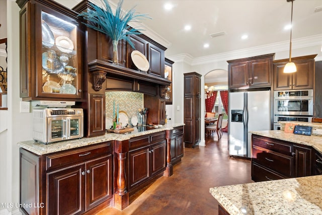 kitchen featuring tasteful backsplash, hanging light fixtures, white fridge with ice dispenser, crown molding, and stainless steel double oven