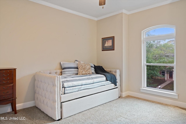 bedroom with crown molding, carpet floors, and ceiling fan