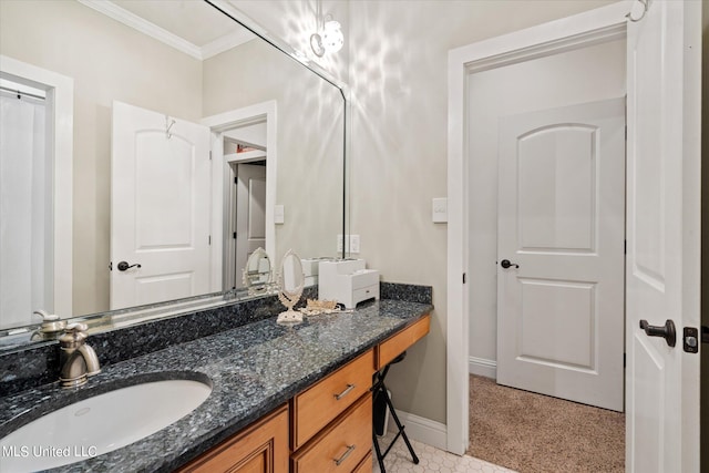 bathroom with vanity and ornamental molding