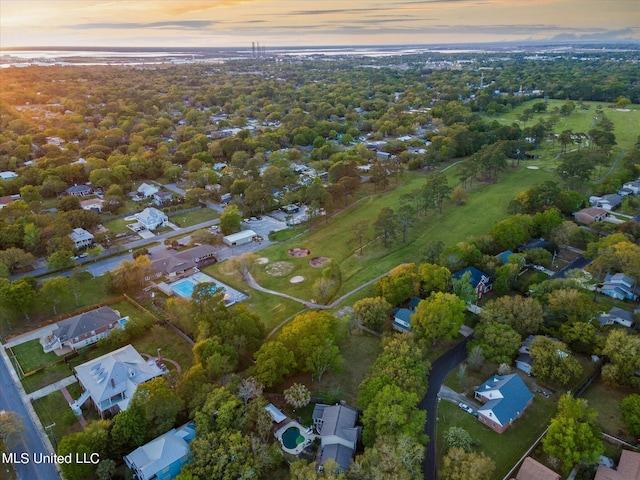 aerial view at dusk with a water view