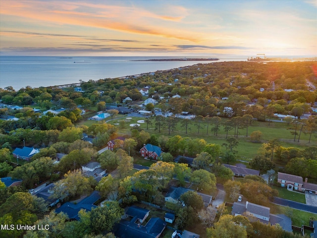 aerial view at dusk with a water view