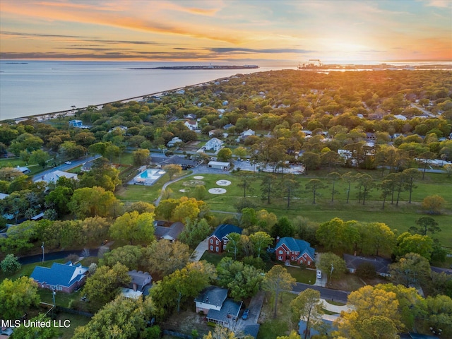 aerial view at dusk with a water view