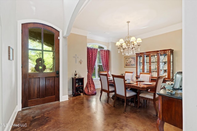 dining area with ornamental molding, an inviting chandelier, and plenty of natural light