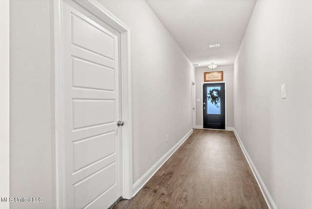 15380 Woodmanse Way, Diberville, MS 39540 - doorway to outside featuring wood finished floors and baseboards