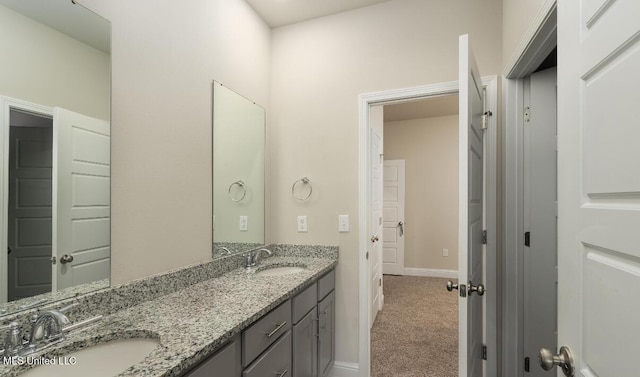 15380 Woodmanse Way, Diberville, MS 39540 - bathroom featuring double vanity and baseboards