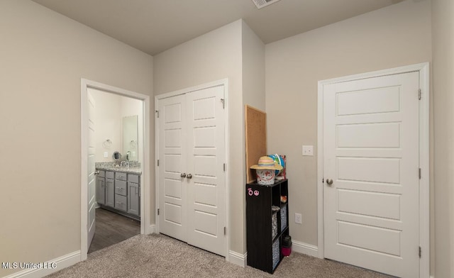 15380 Woodmanse Way, Diberville, MS 39540 - hall with dark colored carpet and baseboards