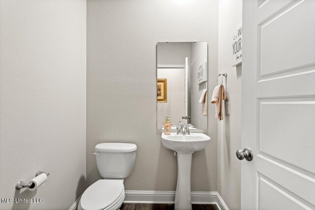 15380 Woodmanse Way, Diberville, MS 39540 - half bath with toilet and wood finished floors