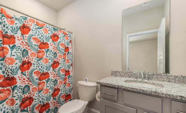 15380 Woodmanse Way, Diberville, MS 39540 - bathroom featuring vanity, toilet, baseboards, and curtained shower