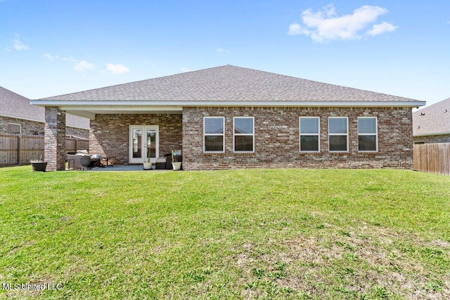 15380 Woodmanse Way, Diberville, MS 39540 - rear view of property featuring brick siding, a shingled roof, and a patio