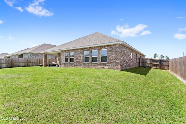 15380 Woodmanse Way, Diberville, MS 39540 - rear view of property with brick siding and roof with shingles