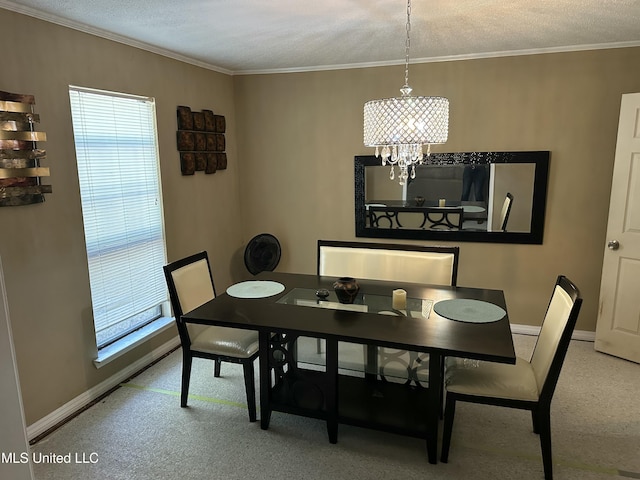 dining space featuring an inviting chandelier, crown molding, and a textured ceiling