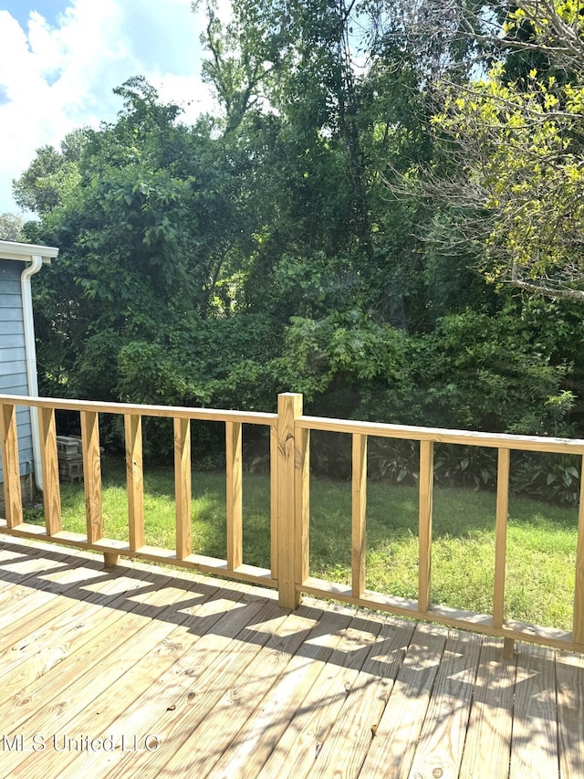 1708 Robinson St, Natchez, MS 39120 - wooden deck featuring a lawn