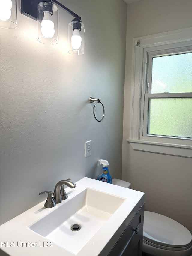 1708 Robinson St, Natchez, MS 39120 - bathroom featuring toilet and vanity