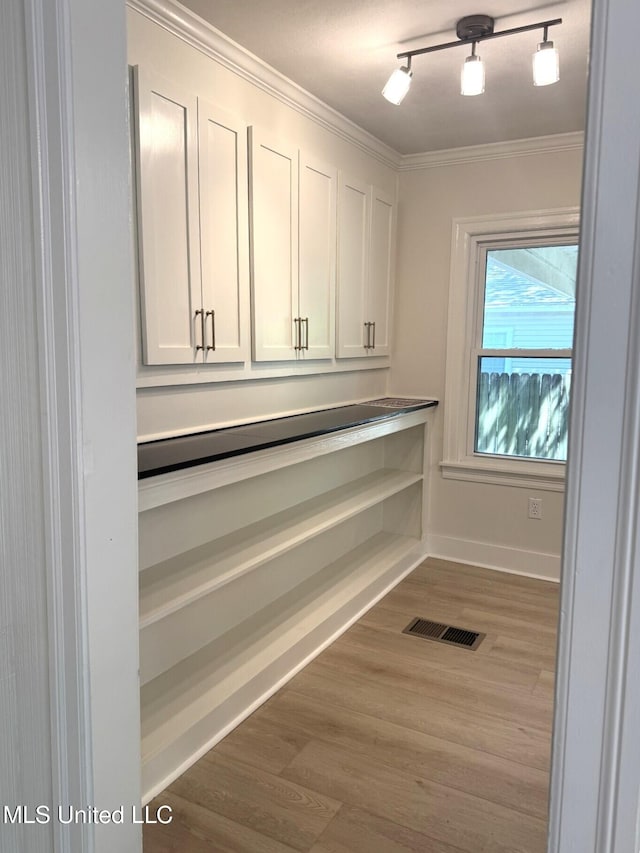 1708 Robinson St, Natchez, MS 39120 - interior space with wood finished floors, visible vents, crown molding, and baseboards