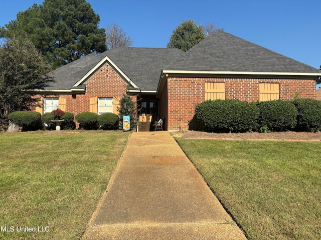 view of front of property with a front lawn