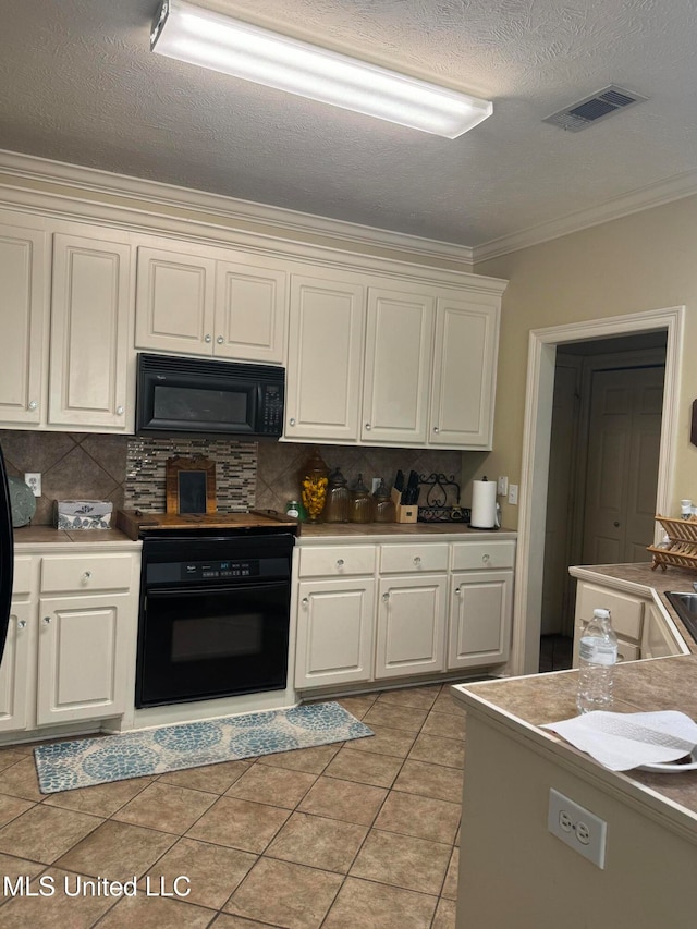 kitchen featuring light tile patterned flooring, ornamental molding, black appliances, and backsplash