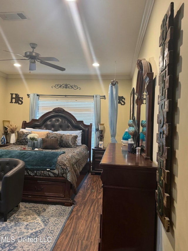 bedroom featuring ceiling fan, crown molding, and dark hardwood / wood-style floors