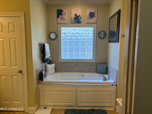 bathroom featuring a bathtub, crown molding, and tile patterned floors