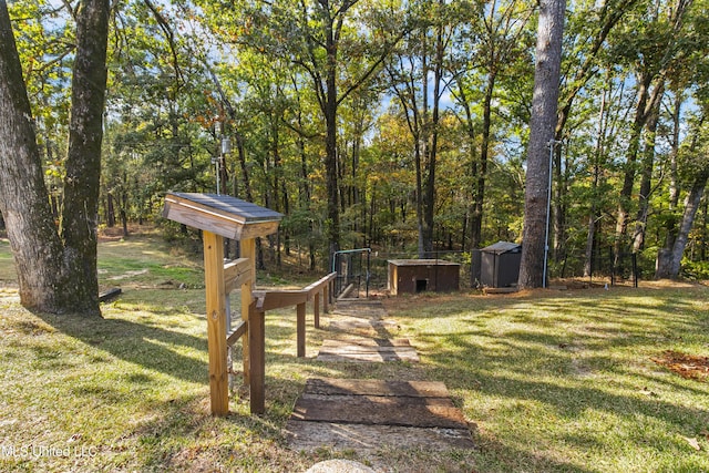1609 SW Linda Dr, Clinton, MS 39056 - view of grassy yard featuring a shed and an outbuilding
