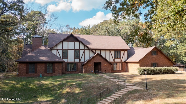 tudor house with a front lawn