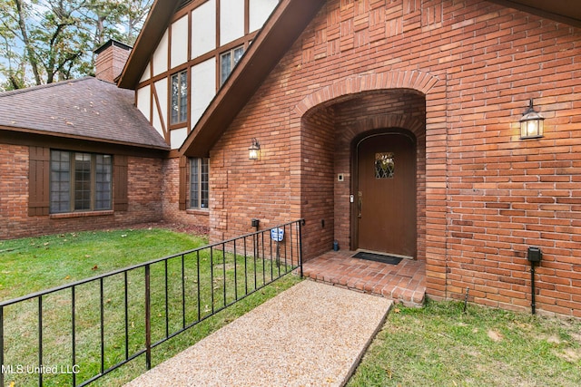 entrance to property with a yard