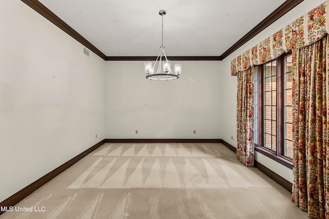 carpeted empty room with ornamental molding and a chandelier