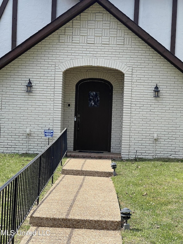 1609 SW Linda Dr, Clinton, MS 39056 - view of exterior entry featuring brick siding and a balcony