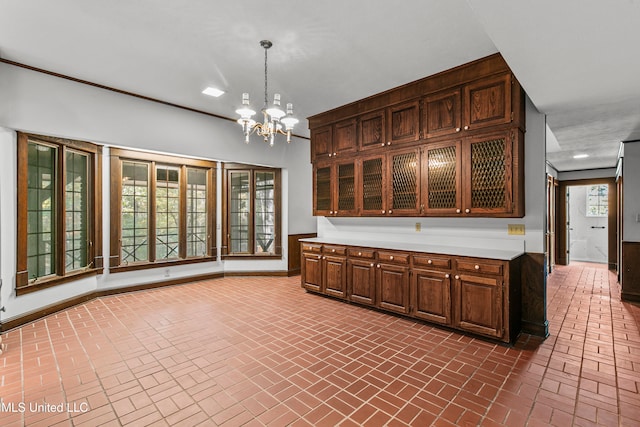 kitchen with decorative light fixtures and a chandelier