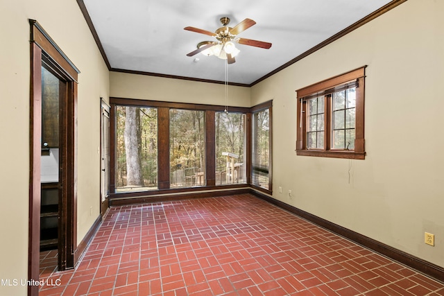 unfurnished sunroom featuring plenty of natural light and ceiling fan