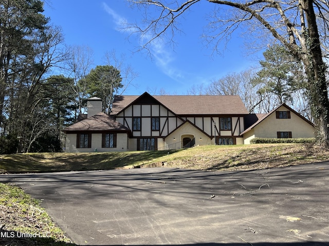 1609 SW Linda Dr, Clinton, MS 39056 - tudor house with a chimney and stucco siding