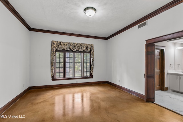 empty room with ornamental molding, a textured ceiling, and light carpet