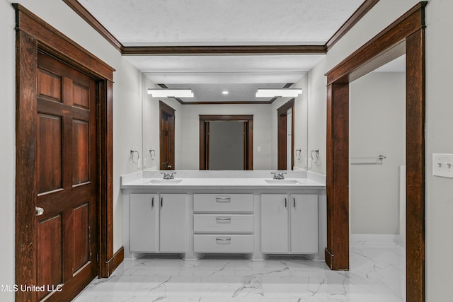 bathroom featuring vanity, crown molding, and a textured ceiling