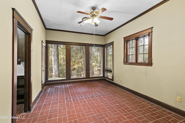 1609 SW Linda Dr, Clinton, MS 39056 - empty room featuring brick patterned floors, baseboards, ceiling fan, plenty of natural light, and ornamental molding