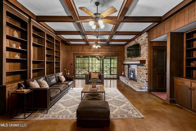 1609 SW Linda Dr, Clinton, MS 39056 - living area featuring wooden walls, built in features, ceiling fan, a fireplace, and beamed ceiling