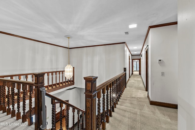 corridor featuring crown molding, a chandelier, and light colored carpet