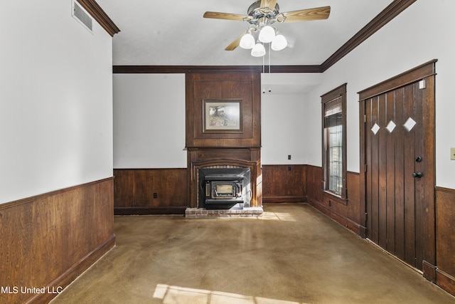 1609 SW Linda Dr, Clinton, MS 39056 - unfurnished living room featuring a wainscoted wall, wooden walls, crown molding, carpet flooring, and ceiling fan