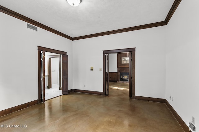 1609 SW Linda Dr, Clinton, MS 39056 - empty room featuring concrete floors, ornamental molding, and baseboards