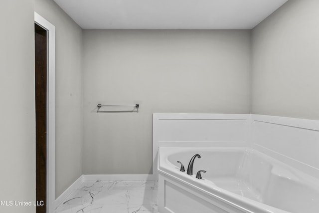 1609 SW Linda Dr, Clinton, MS 39056 - full bath featuring marble look tile flooring, baseboards, and a garden tub