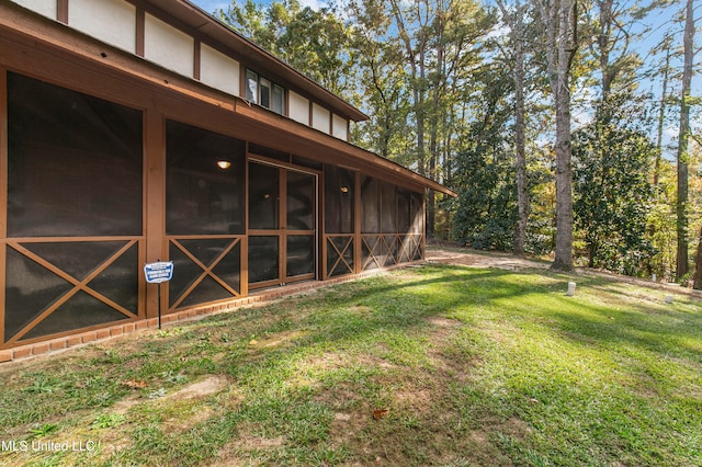 view of yard with a sunroom