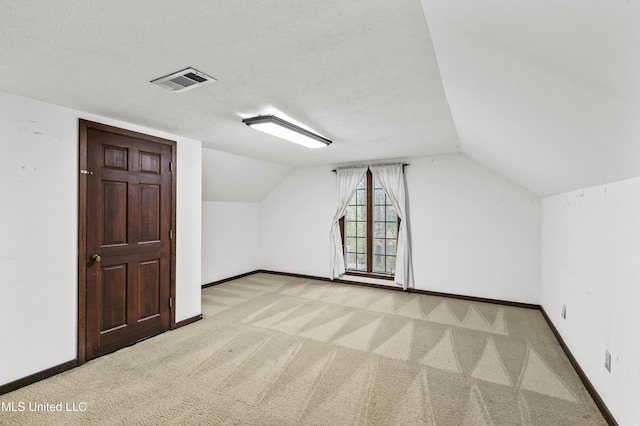 1609 SW Linda Dr, Clinton, MS 39056 - additional living space with carpet, vaulted ceiling, and baseboards
