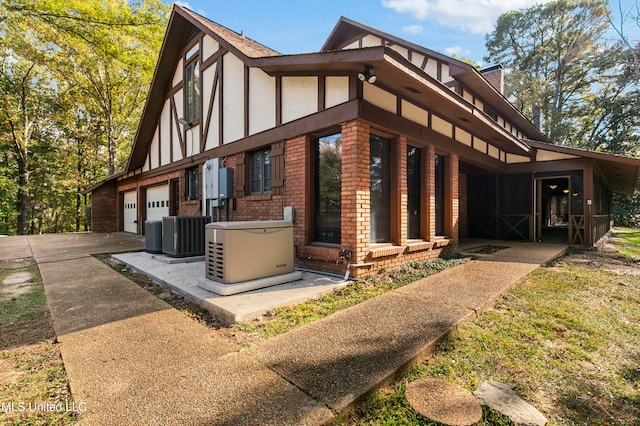 view of home's exterior with central AC