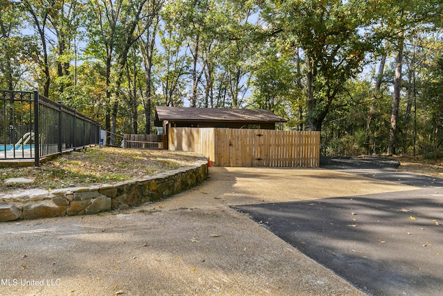 1609 SW Linda Dr, Clinton, MS 39056 - view of side of property with fence and a gate