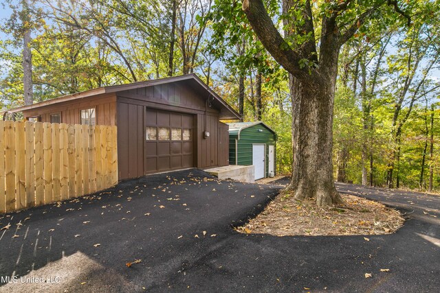 1609 SW Linda Dr, Clinton, MS 39056 - detached garage with fence and asphalt driveway
