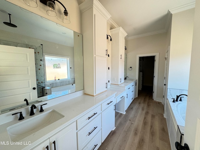 bathroom with ornamental molding, vanity, independent shower and bath, and hardwood / wood-style flooring