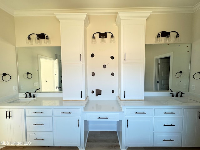 bathroom featuring hardwood / wood-style flooring, vanity, and crown molding