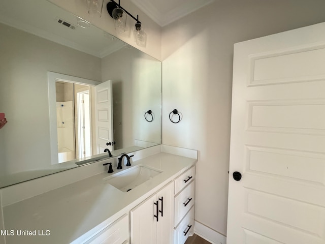 bathroom featuring vanity and crown molding