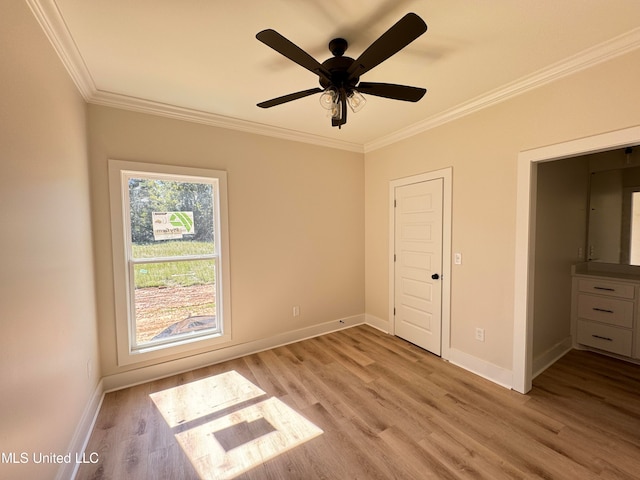 unfurnished bedroom with ceiling fan, light hardwood / wood-style flooring, and crown molding