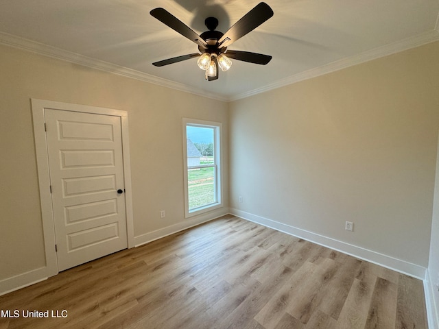 spare room featuring light hardwood / wood-style flooring, ceiling fan, and crown molding