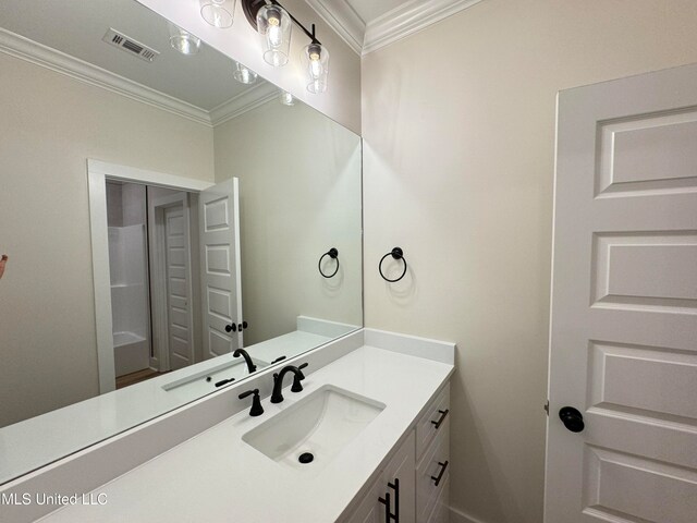 bathroom with vanity and crown molding